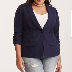 Navy one-button blazer with ruched sleeves.